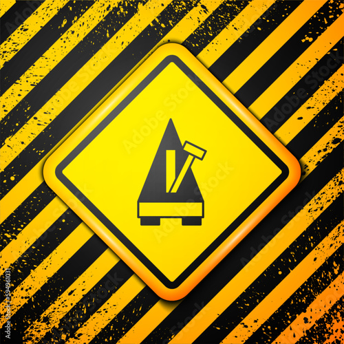 Black Classic Metronome with pendulum in motion icon isolated on yellow background. Equipment of music and beat mechanism. Warning sign. Vector