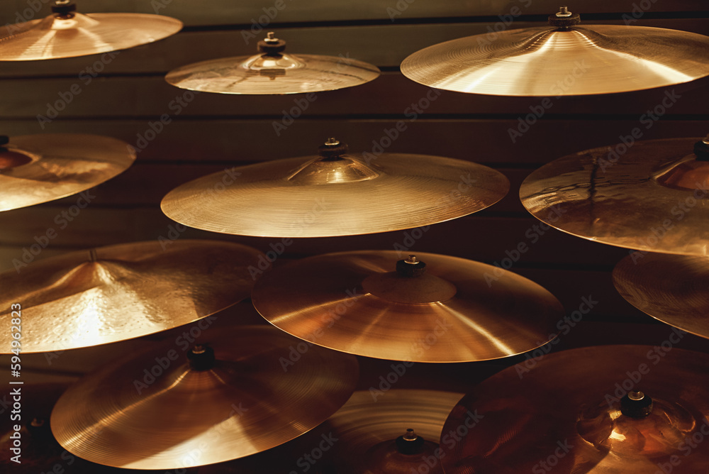 Visiting musical instrument store. Different types of drum cymbals for