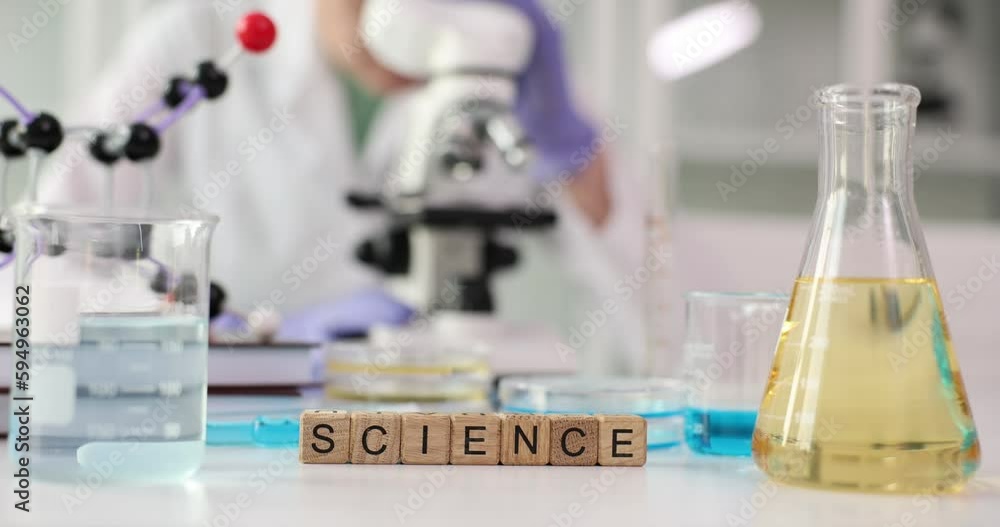 The laboratory has wooden cubes with the inscription science, close-up. Medical research, scientific discovery The laboratory has wooden cubes with the inscription science, close-up. Medical research, scientific discovery