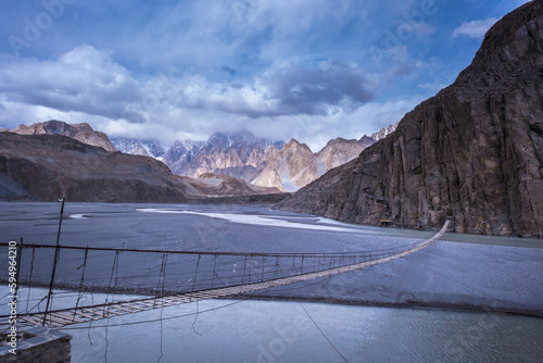 Hussaini Suspension Bridge Located in the Hunza Valley Hanging over Lake Borit north of pakistan photo