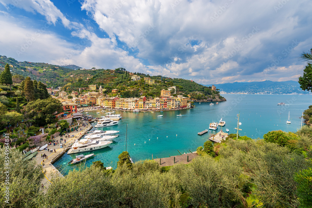 Panoramic view of the famous village of Portofino, luxury tourist resort in Genoa Province, Liguria, Italy, Europe. Port and colorful houses, Mediterranean sea (Ligurian sea).