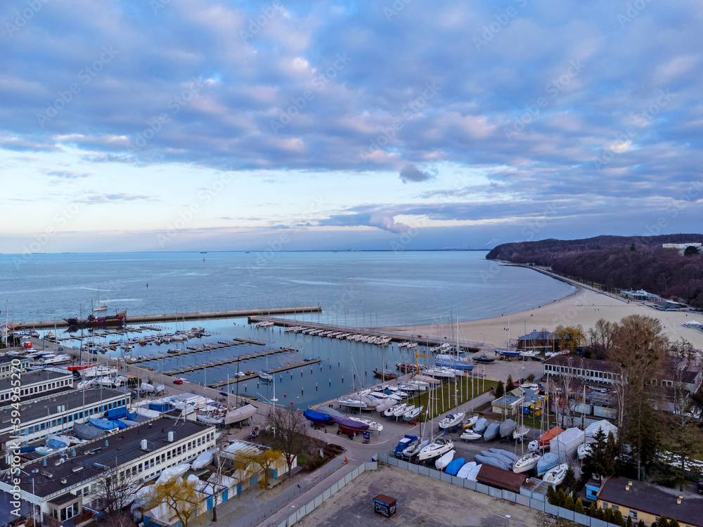 Aerial view landscape Poland Gdynia. Port with sailboats , view of beach and sea. Colorful sky.