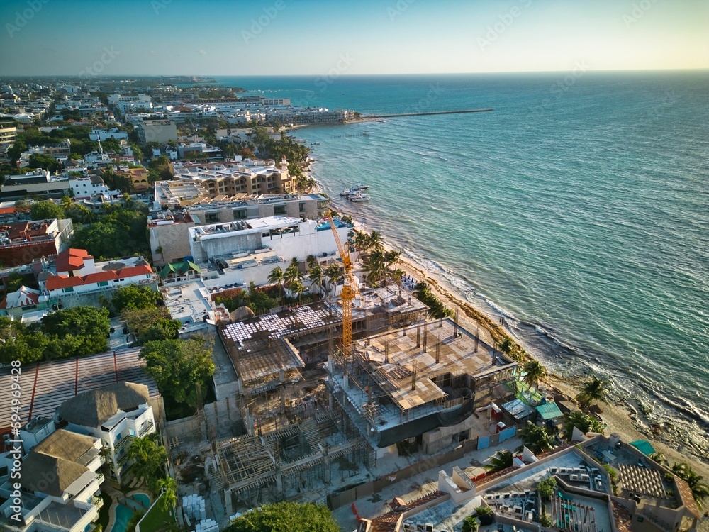 Aerial of Playa del Carmen town skyline surrounded by a sandy beach and the sea