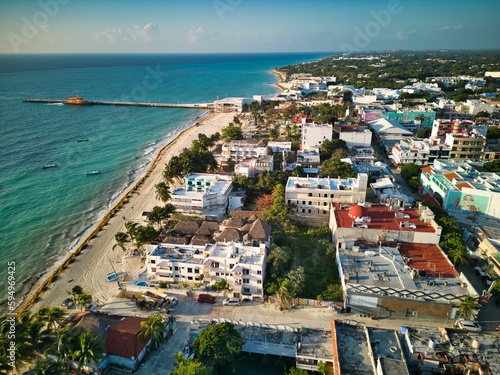 Aerial of Playa del Carmen town skyline surrounded by a sandy beach and the sea
