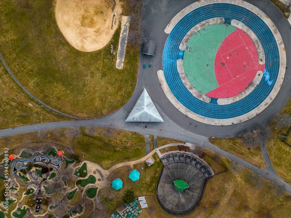 Aerial top view over an empty park with different ball courts for sports and playground areas Aerial top view over an empty park with different ball courts for sports and playground areas