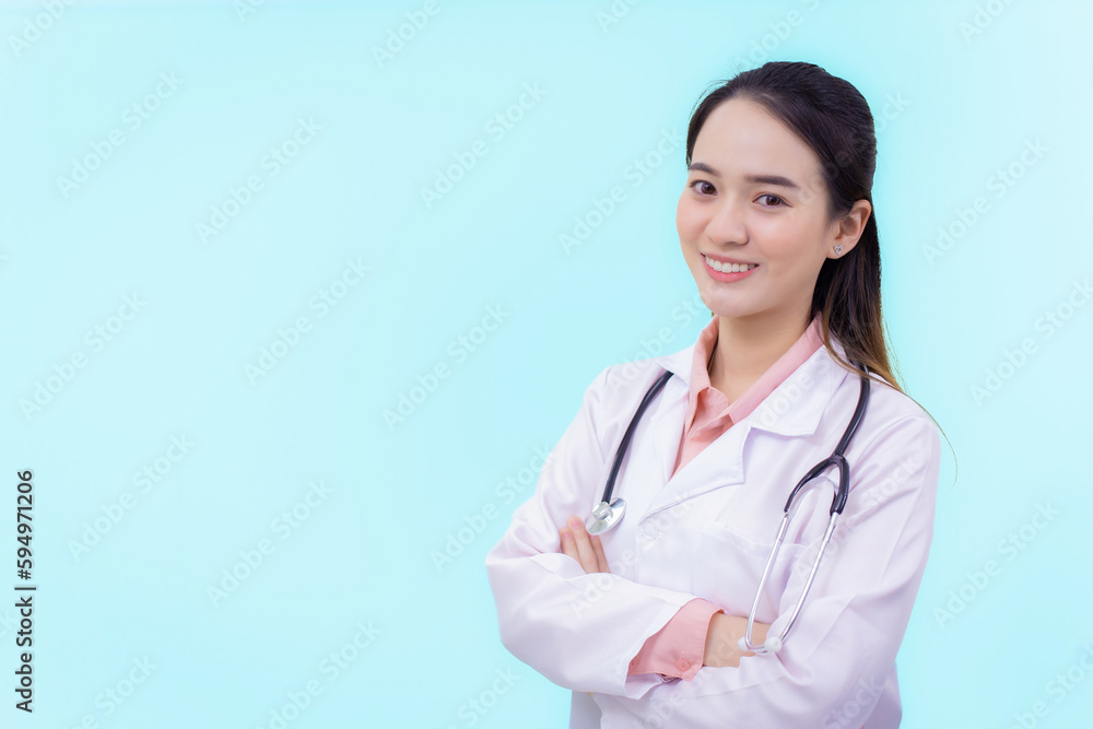 Asian woman doctor standing with arms crossed happy and smile in hospital Asian woman doctor standing with arms crossed happy and smile in hospital