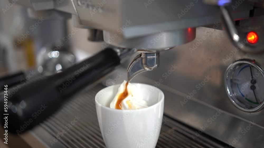 Coffee machine making an espresso affogato hot drink in cafe bar Coffee machine making an espresso affogato hot drink in cafe bar