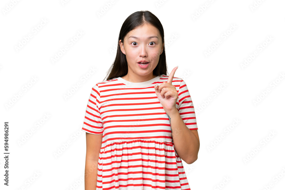Young Asian woman over isolated background keeping a conversation with the mobile phone Young Asian woman over isolated background keeping a conversation with the mobile phone