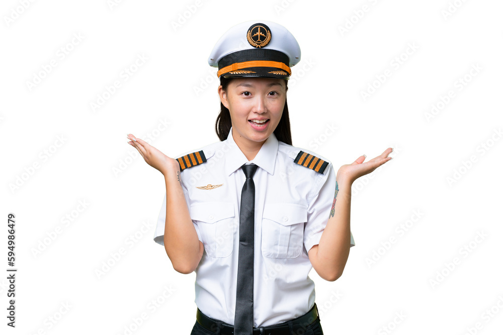 Airplane pilot Asian woman over isolated background with shocked facial expression Airplane pilot Asian woman over isolated background with shocked facial expression