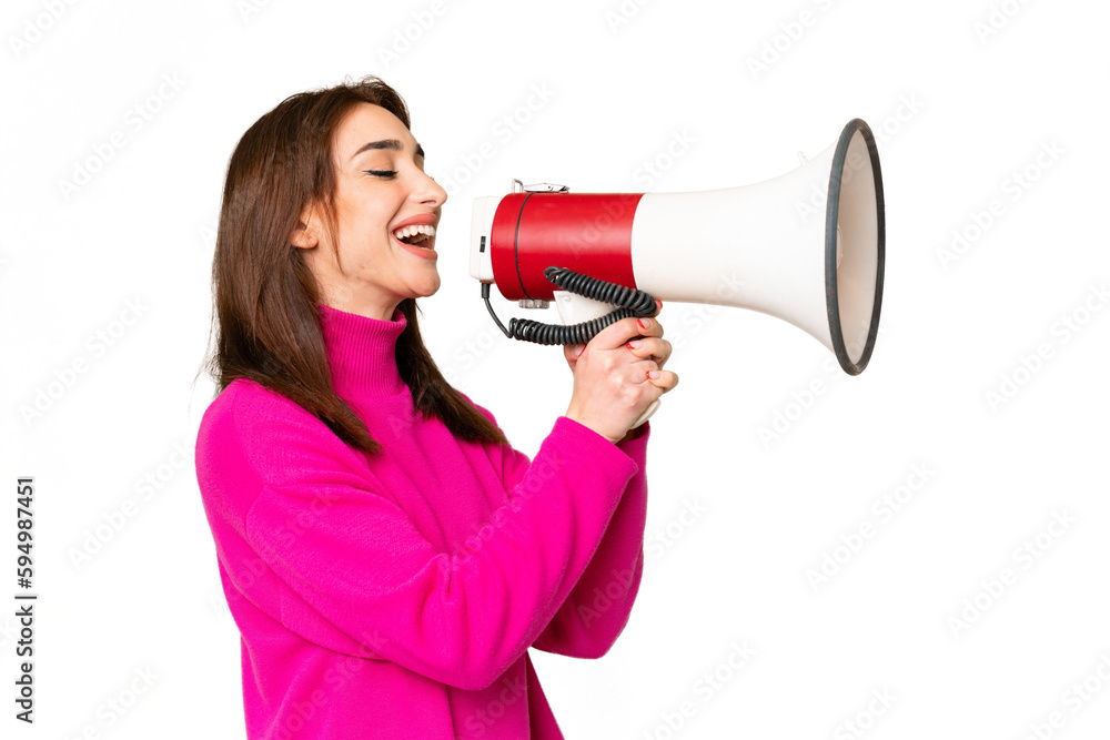 Young caucasian woman over isolated chroma key background shouting through a megaphone Young caucasian woman over isolated chroma key background shouting through a megaphone