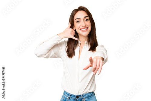 Young caucasian woman over isolated chroma key background making phone gesture and pointing front