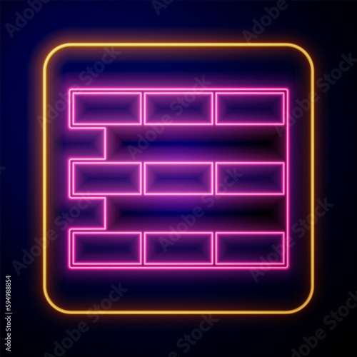 Glowing neon Bricks icon isolated on black background. Vector