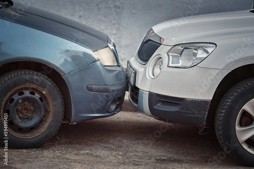 Car parking collision, minor damage. Parking accident between two cars on the street. Road accident. .