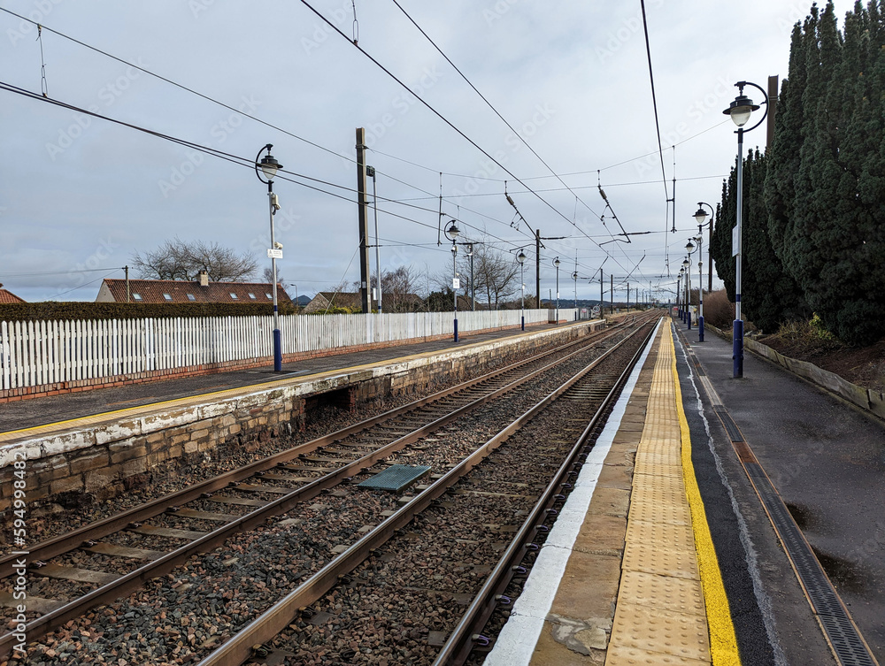 A view along the station platform and rails at Drem, East Lothian, Scotland, UK. A view along the station platform and rails at Drem, East Lothian, Scotland, UK.