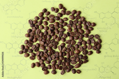 Large optimally roasted African coffee beans from Tanzania. On the background of molecules of organic substances contained in coffee. photo