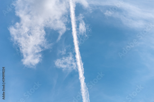 contrail of a rocket launch in the blue sky in Ukraine