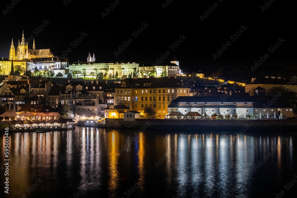 Cityscape of Prague from the Charles Bridge at night in the Czech Republic