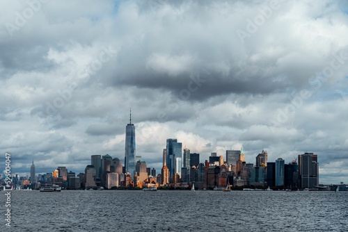 Cityscape of bustling New York city during daytime with a cloudy sky