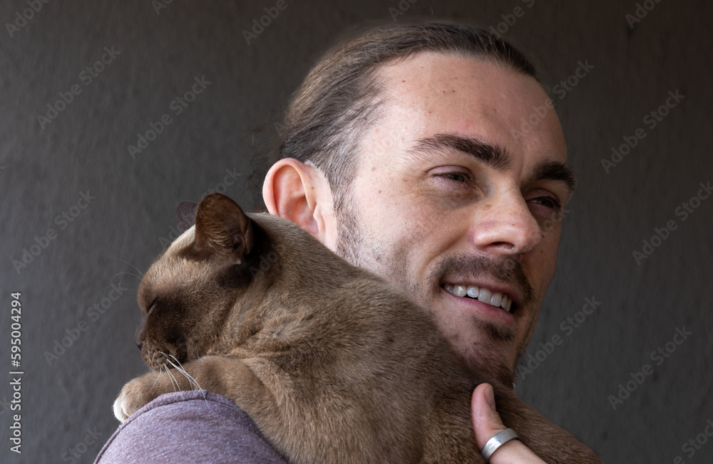 portrait of a man with a beard and a cat