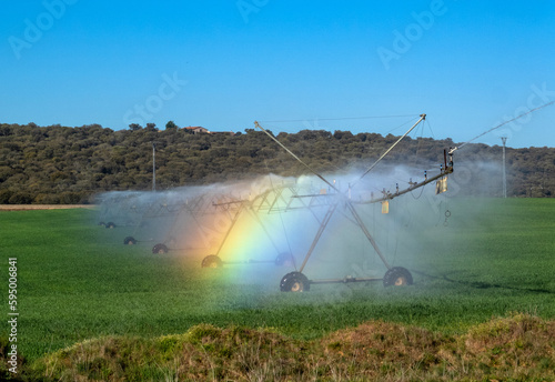 Máquina de riego de pivote central que produce un efecto arcoíris. Provincia de Zamora. photo