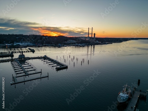 Aerial view of the Port Jefferson Harbor during a beautiful and cloudless sunset in the winter © Audley C Bullock/Wirestock Creators