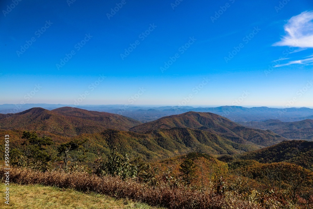 a view of mountains and valleys from the top of a mountain