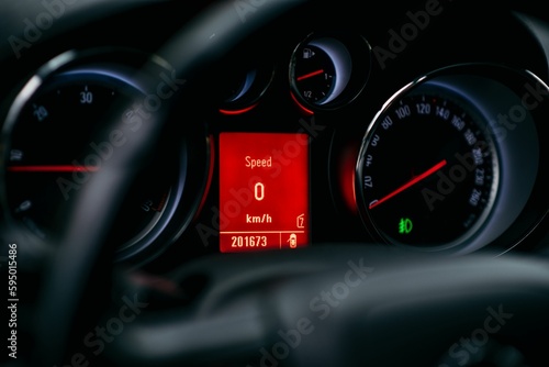 Close-up shot of a car's dashboard with a digital speedometer