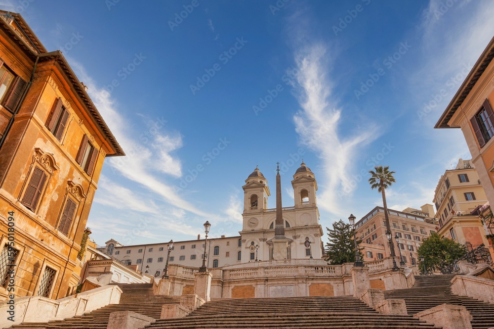Obraz premium Spanish Steps monument under a blue sky with clouds in Rome, Italy.