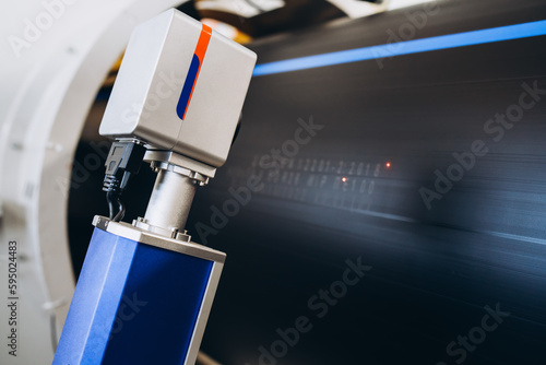 Laser Marking Machine Engraving. Manufacture of plastic water pipes of the factory.