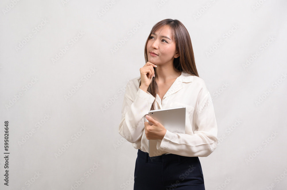 Young asian businesswoman using tablet over white background, technology concept Young asian businesswoman using tablet over white background, technology concept
