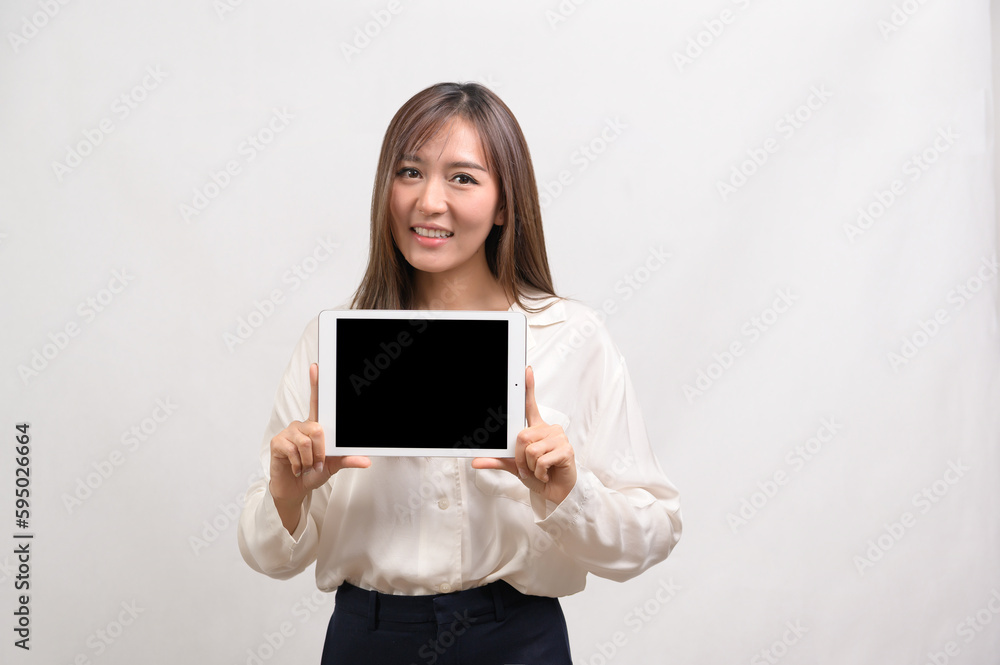 Young asian businesswoman using tablet over white background, technology concept Young asian businesswoman using tablet over white background, technology concept