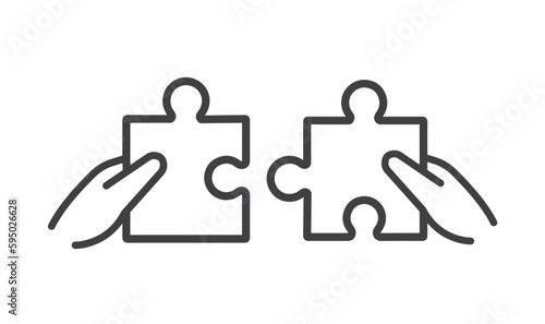 Two hands with a puzzle piece.