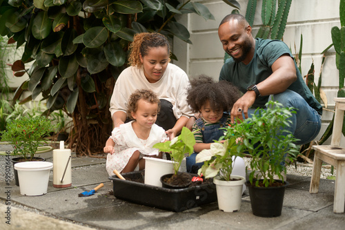 Wallpaper Mural Happy African American family enjoying gardening at home Torontodigital.ca