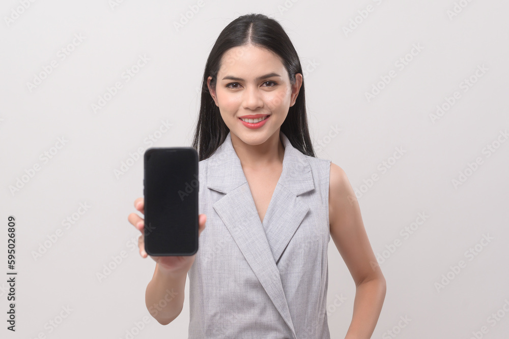 Naklejka premium Beautiful woman using smartphone over white background, technology concept. ..
