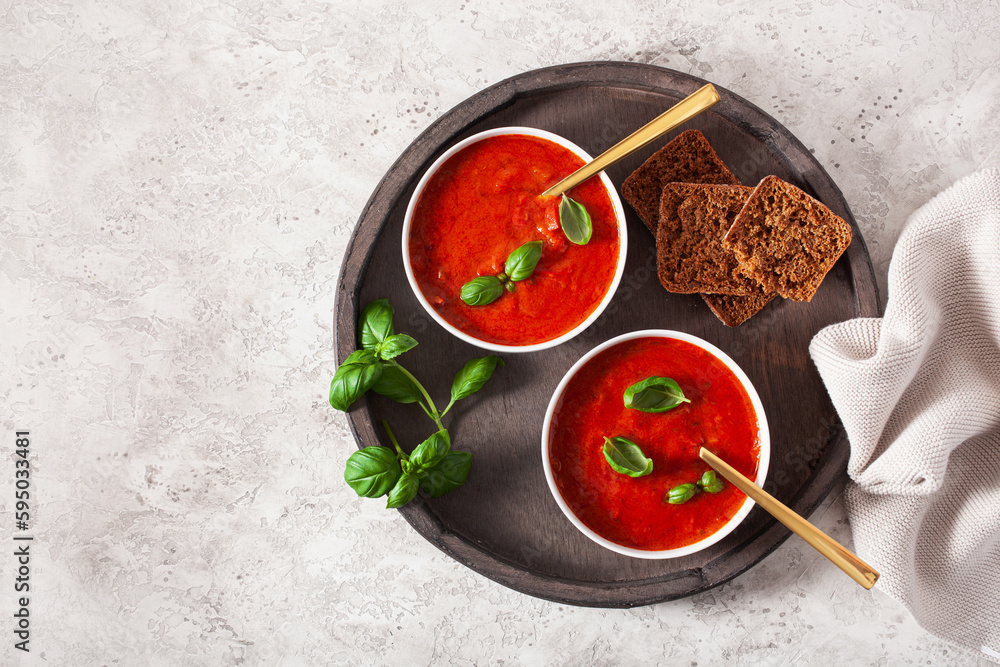 tomato and bell pepper vegetarian soup on green background tomato and bell pepper vegetarian soup on green background