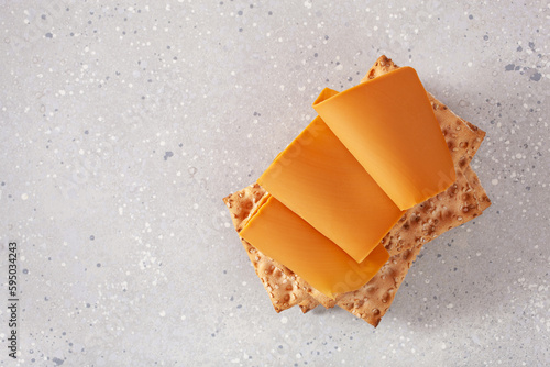 Photos crispbread with Norwegian brunost traditional brown cheese