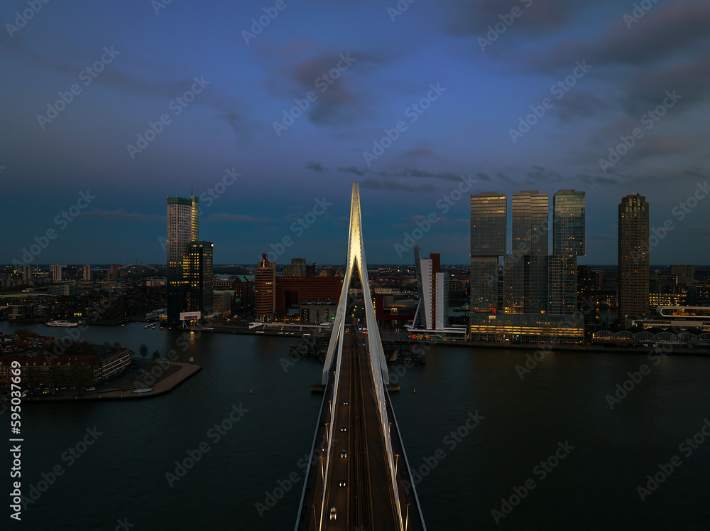 Fototapeta premium rotterdam citscape near by Erasmus bridge. Amazing colorful photo in sunset time.