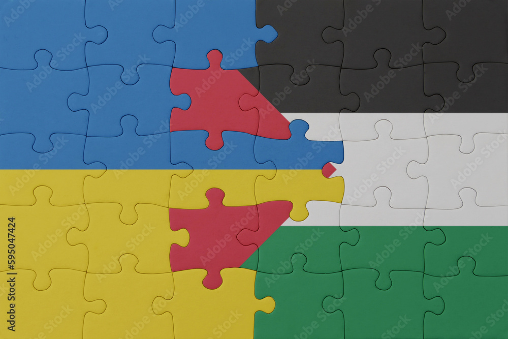 puzzle with the national flag of ukraine and palestine . macro.concept. puzzle with the national flag of ukraine and palestine . macro.concept.