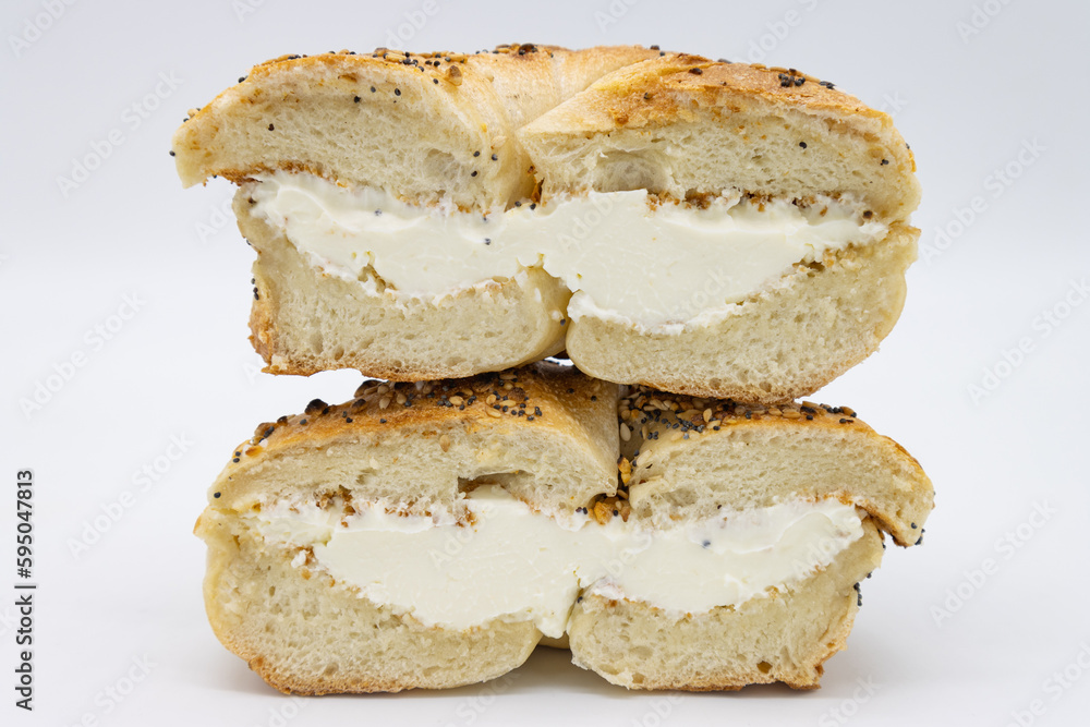 Cut in Half and Stacked New York City Style Toasted Everything Bagel with Cream Cheese Cut in Half and Stacked New York City Style Toasted Everything Bagel with Cream Cheese