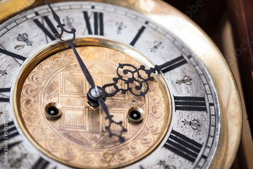 Vintage Clock with Hands.Close up view on clock face of a historical watches with golden frame