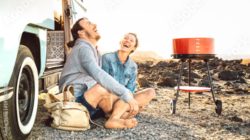 Quadro em tela Hipster couple traveling together with oldtimer mini van transport - Travel life