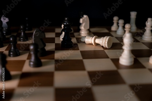 Картината върху платно A dramatic depiction of the fallen white king chess piece on a chessboard