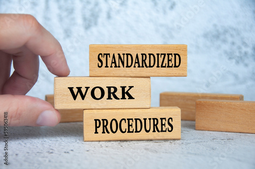 Принти на полотні Standard work procedures text on wooden blocks. Business concept