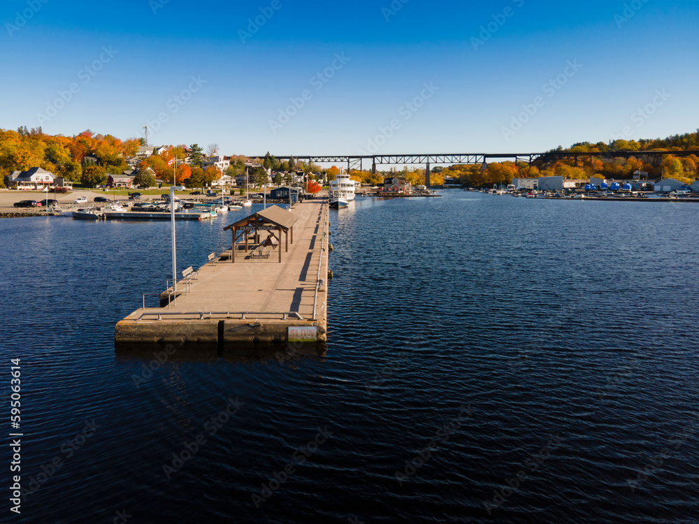 Aerial panoramic view of Parry Sound Ontario -  small tourist town and marina with cruise ships, yachts and sail boats by the lake.