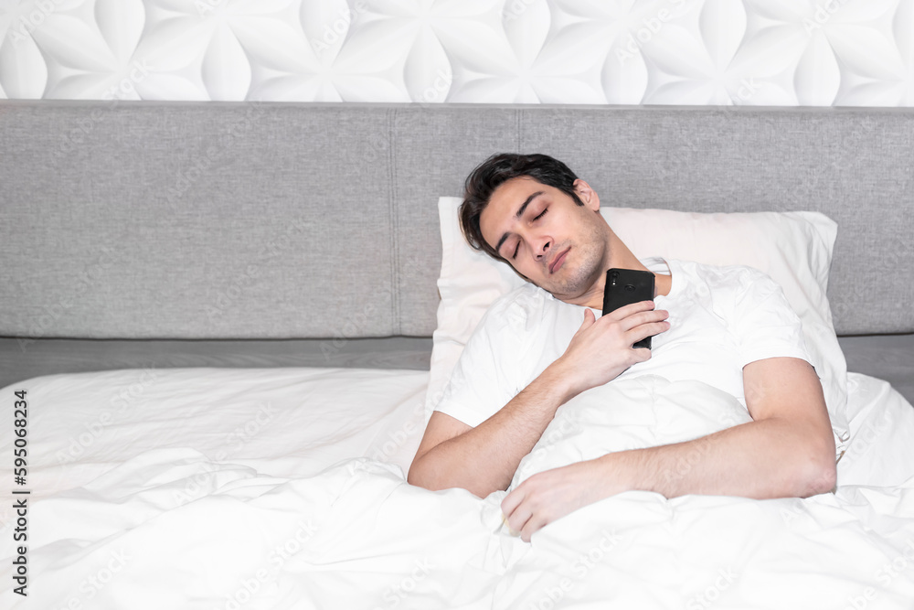 Handsome man suddenly slept during chatting or watching video on his smartphone Handsome man suddenly slept during chatting or watching video on his smartphone