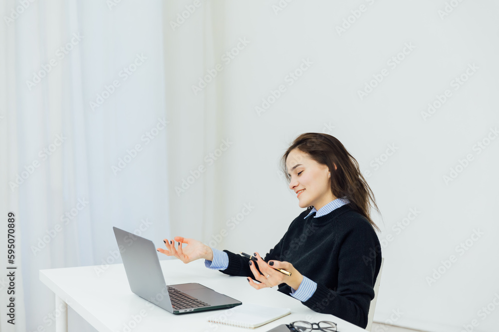 woman with laptop in office at remote work internet communication IT work woman with laptop in office at remote work internet communication IT work