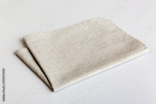 top view with gray kitchen napkin isolated on table background. Folded cloth for mockup with copy space, Flat lay. Minimal style