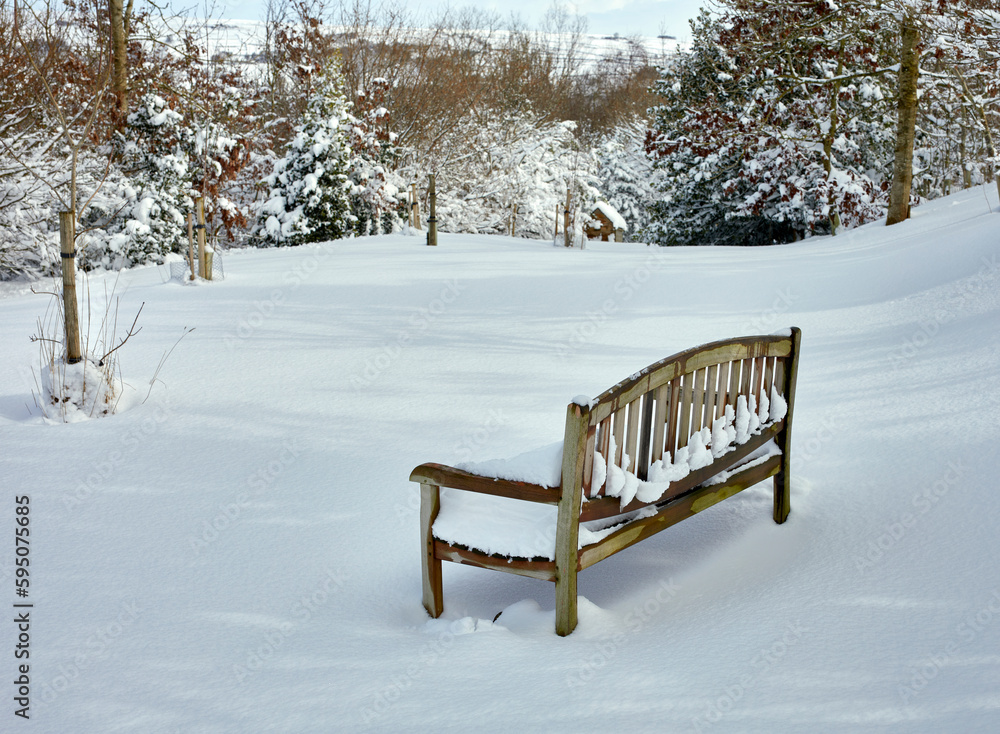 The garden seat remains unused the morning after heavy overnight snow on moorland smallholding at 900ft in North Yorkshire