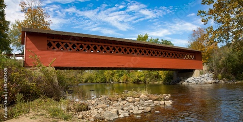 The Henry covered bridge over the Walloomsac river near lBennington, Vermont photo