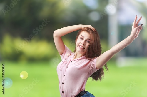 Happy young woman laughing in a sunny day